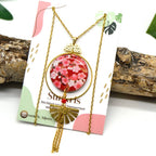 Collana lunga giapponese con fiori rossi – acciaio inox e resina